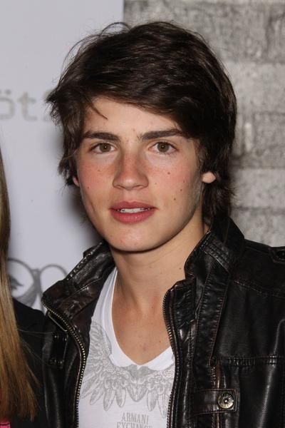 Debby Ryan and Gregg Sulkin with Gregg Sulkin at young hollywood party