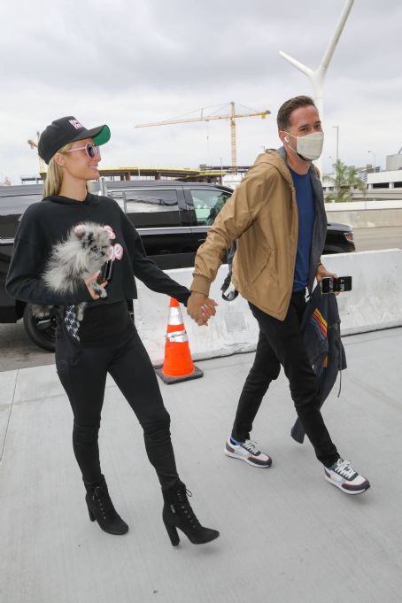 Paris Hilton and Carter Reum – Seen at a airport
