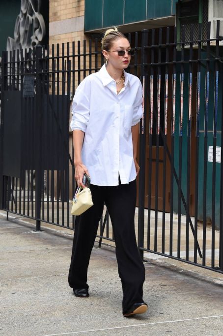 Gigi Hadid – Wearing white shirt as she takes a stroll on the streets of New York