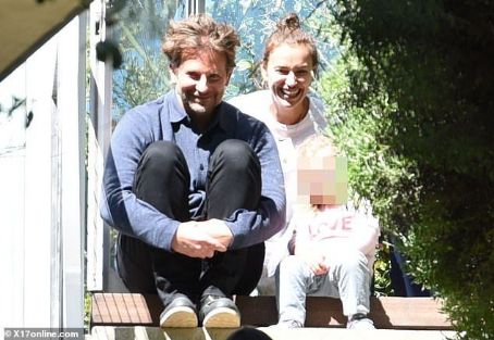 Bradley Cooper looks the picture of happiness with girlfriend Irina Shayk and their daughter Lea... as they dispel rumours of strife following Lady Gaga cheating allegations