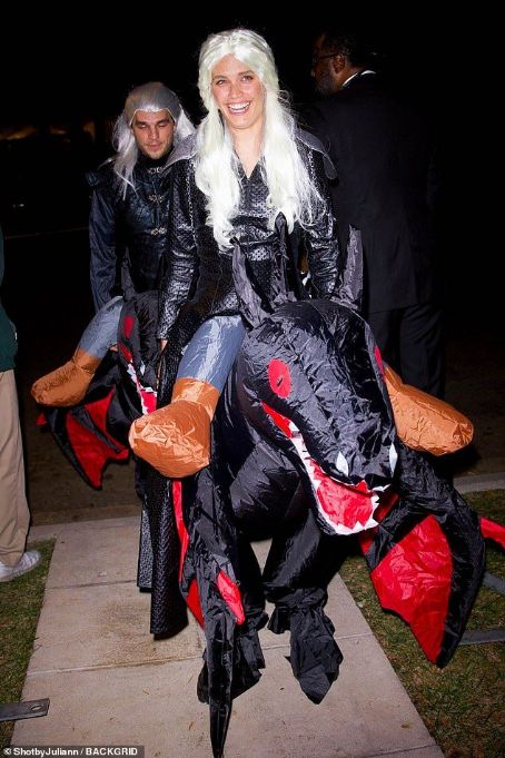 Sara Sampaio embodies Rhaenyra Targaryen with platinum wig and inflatable dragon while attending Casamigos Halloween party in Beverly Hills with beau Zac Frognowski