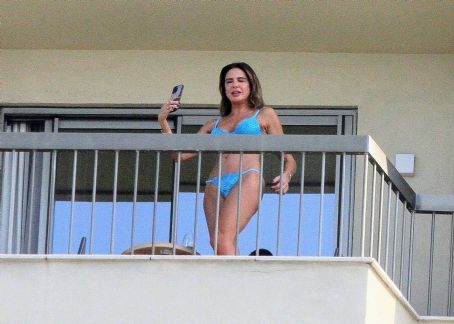 Luciana Gimenez – In a blue bikini on the balcony of her hotel in Rio de Janeiro