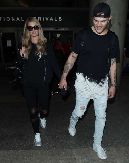Paris Hilton and Fiance Chris Zylka at LAX airport in LA