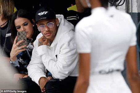 Neymar attends Paris Fashion Week with glamorous girlfriend Bruna Marquezine as team-mate Dani Alves dons bizarre leather gloves