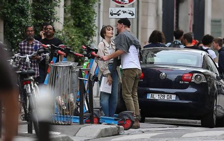 Lily Collins – With new boyfriend Charlie McDowell go for a ride in scooter in Paris