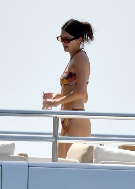 Kendall Jenner – Seen in multicolored bikini on a yacht in Capri