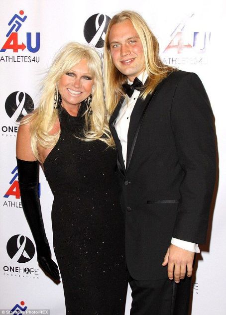 Linda Hogan, 54, is being sued by ex-toy boy Charlie Hill, 24, for $1.5 MILLION as he claims she made him do too much menial labour at her home