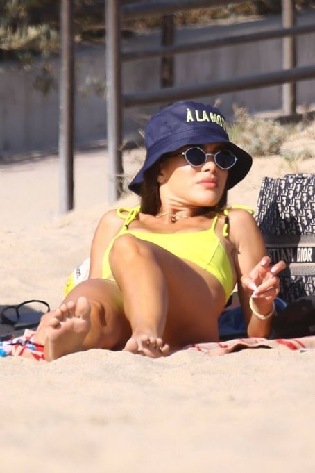 Camila Coelho stuns in yellow bikini while enjoying a beach day with  Alessandra Ambrosio in Santa