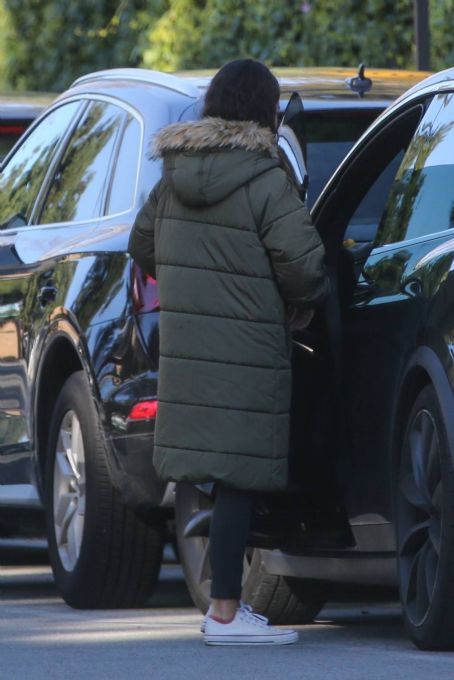 Mila Kunis – Out in olive green puffer jacket in Beverly Hills