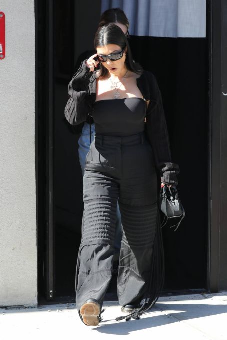 Kourtney Kardashian – In all black at the BooHoo store in West Hollywood