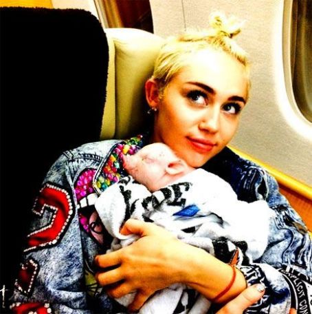 Miley Cyrus Gets a Pet Piglet, Snuggles up with New Pet on her Private Jet