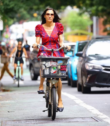 Famke Janssen – Wears colorful dress while out for a bike ride in New York