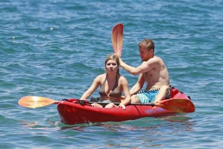 Jennette McCurdy wearing a pretty bikini and board shorts was spotted kayaking with a male friend in Maui