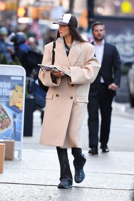 Bella Hadid – Spotted on Manhattan with a trench coat and Salomon sneakers