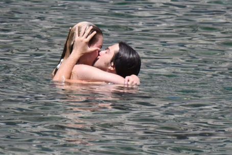 Grace Van Patten in White and Red Bikini at the beach in Ischia