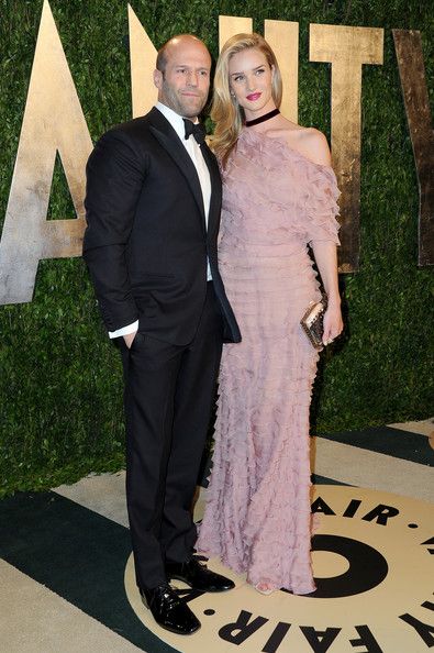 Actor Jason Statham and actress Rosie Huntington-Whiteley arrive at the 2013 Vanity Fair Oscar Party hosted by Graydon Carter at Sunset Tower on February 24, 2013 in West Hollywood, California