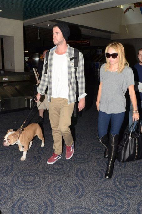 Miley Cyrus and Liam Hemsworth: making their way through Philadelphia International Airport