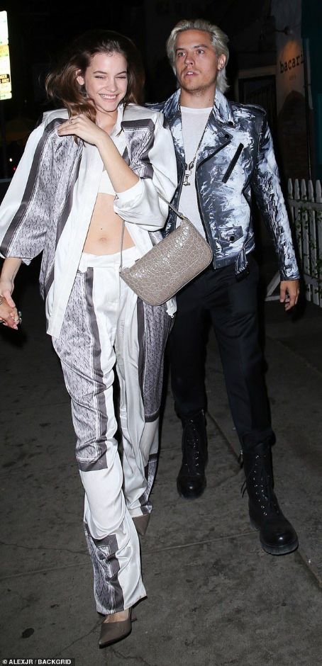 Dylan Sprouse and his model girlfriend Barbara Palvin opt for matching metallic ensembles as they attend a haircare event