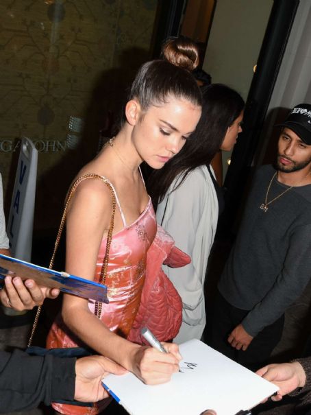 Maia Mitchell – In a short PVC Material dress leaving Catch in West Hollywood