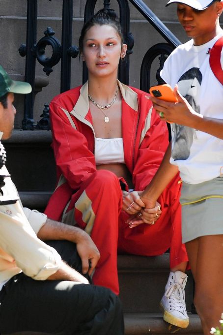 Bella Hadid Shows Off Abs in Sports Bra and Red Track Suit in NYC