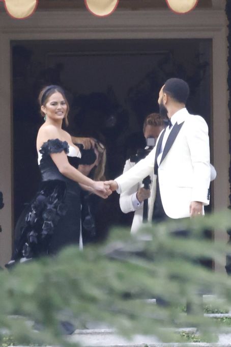 Chrissy Teigen – Pictured on the balcony of Villa Passalacqua in Como