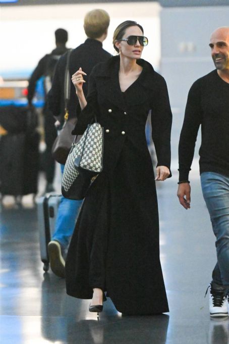 Angelina Jolie Sports Dior Trench & Celine Tote Bag at JFK