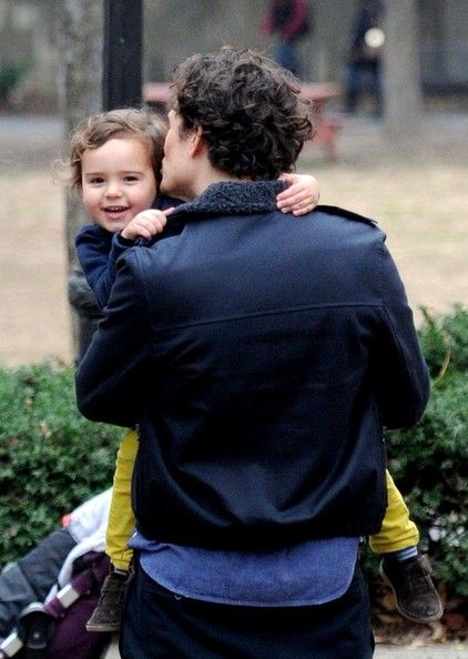 Orlando Bloom treats his curious son Flynn to a ride on his back
